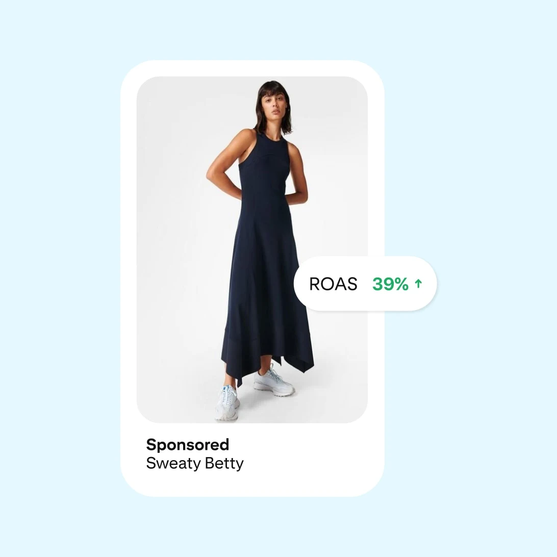 Ad showing a woman in a navy maxi dress and sneakers, with a "ROAS 39%" bubble. Sponsored by Sweaty Betty.