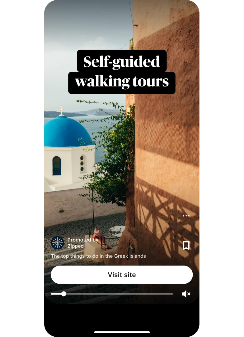 Idea ad preview thumbnail showing a picturesque Grecian  water view titled “Self-guided walking tours” with a “Visit site” button placed center bottom.
