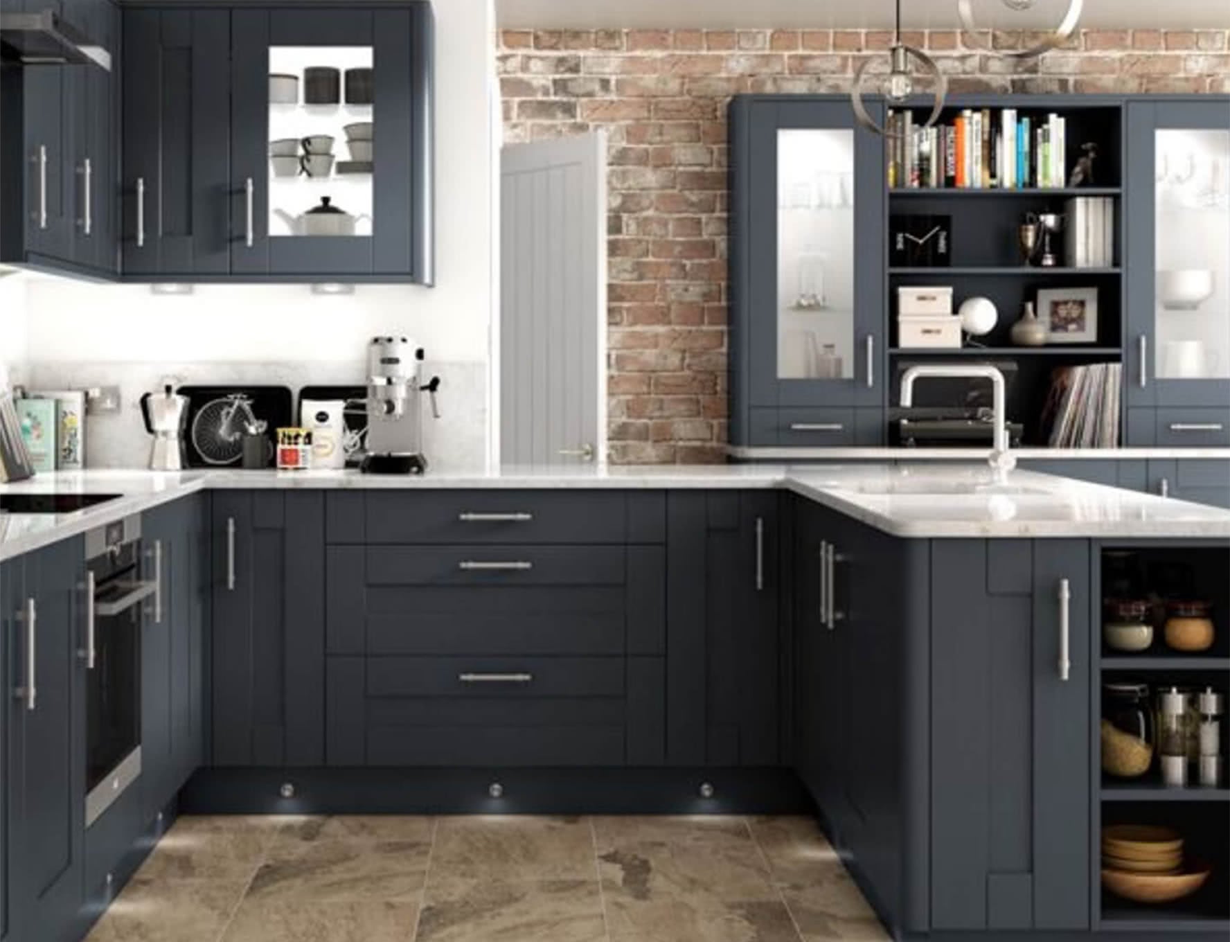 A modern kitchen with exposed brick walls, white worktops and steel grey cabinets