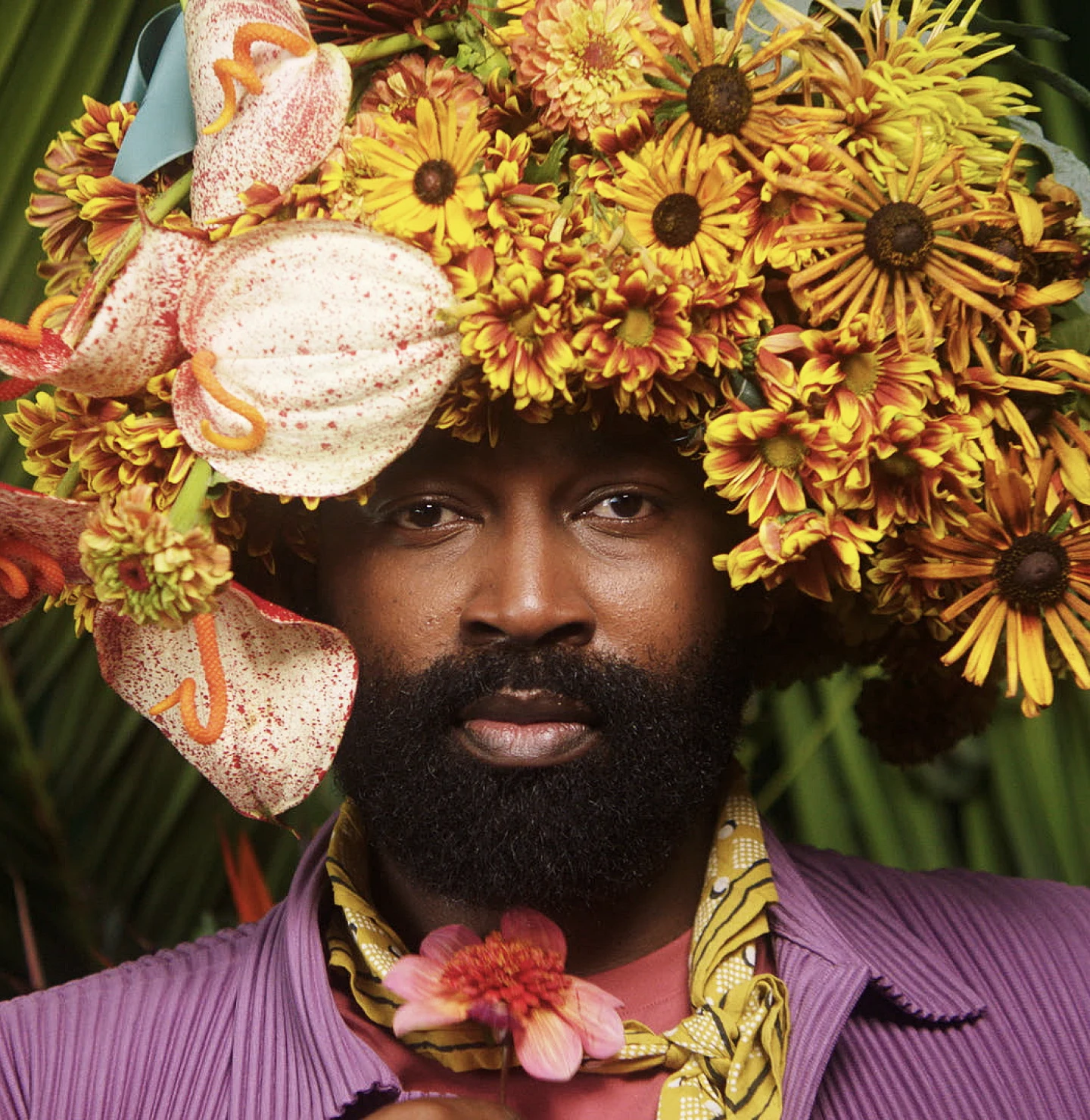 Maurice Harris of Bloom & Plume wears a floral arrangement hat