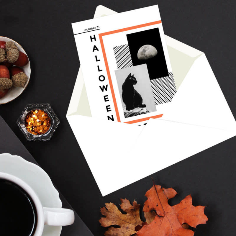 Flat lay photography featuring open Halloween party invitation, fall leaves, coffee, and snacks.