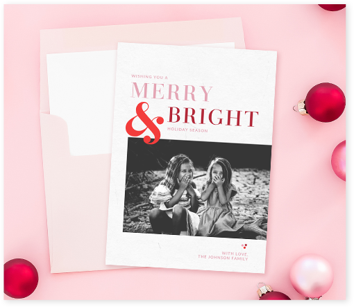 Beautiful PicMonkey Christmas card template against pink background with ornaments around it. 