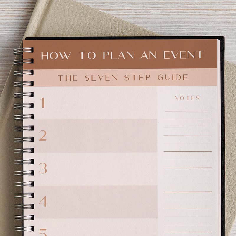 An open planner page with a light brown banner that reads "How To Plan an Event" and a light pink banner underneath that reads "The Seven Step Guide." Alternating shades of pink going down with numbers and a section for notes on the right hand side.