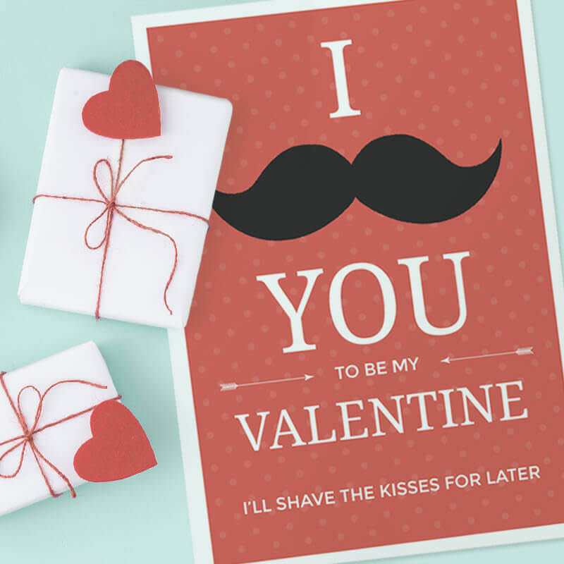 Punny Valentine's Day card that reads "I mustache you to be my Valentine" with a black mustache graphic. Red background with white polka dot texture and red heart graphics on the left side of the image. Light blue background.