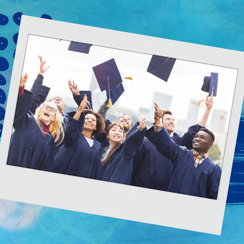 Multiple grad students with dynamic faces throwing cap into the air at graduation and wearing dark blue robes against textured light blue background.