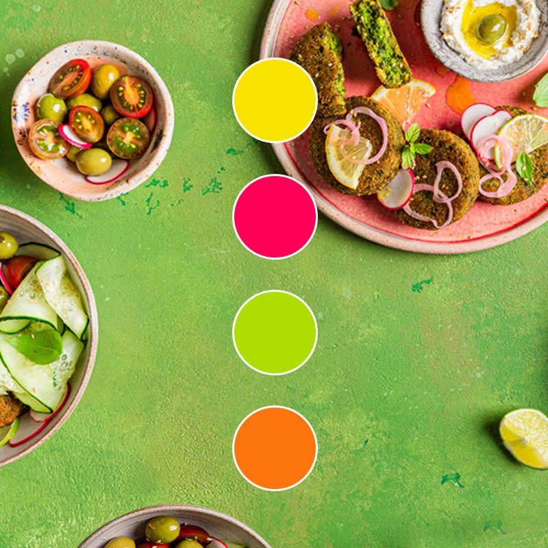 Bright green textured background with image of food and it's associated color palette of yellow, pink, green, and orange.