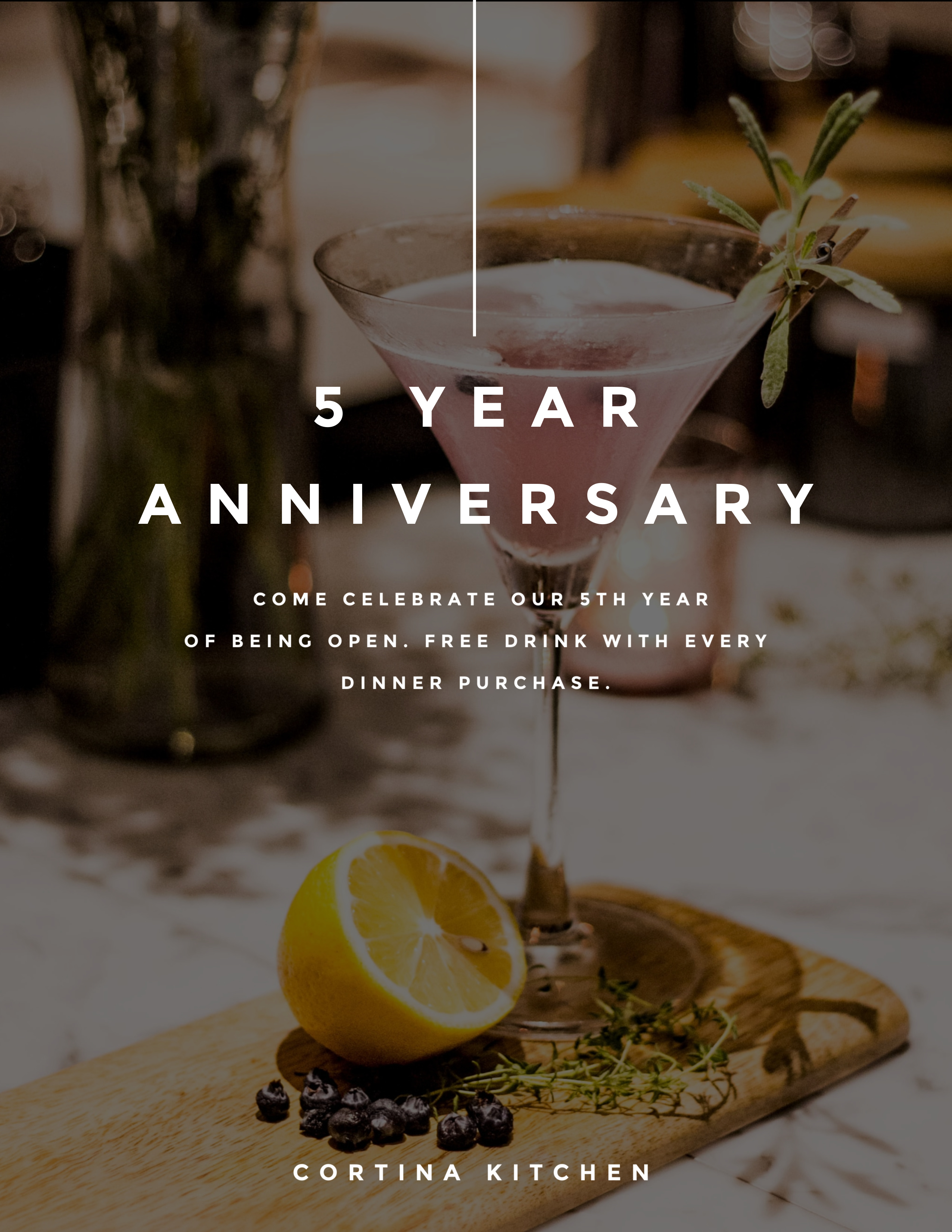 alcoholic beverage with lemon on table