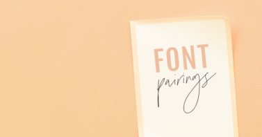 "Font pairings" text on single sheet of paper, set against pastel orange background. 