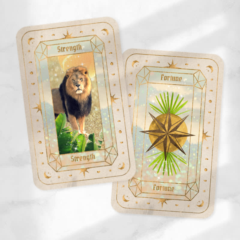Fantasy trend design: two golden sparkly oracle cards. Left reads "Strength" with a lion and star glitter shapes in the background. Right reads "Fortune" with golden centralized star and green spikes in background.