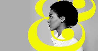 Black and white image of woman with yellow ampersand layered into design.