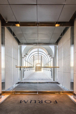 The covered walkway to the parking garage from the Forum building