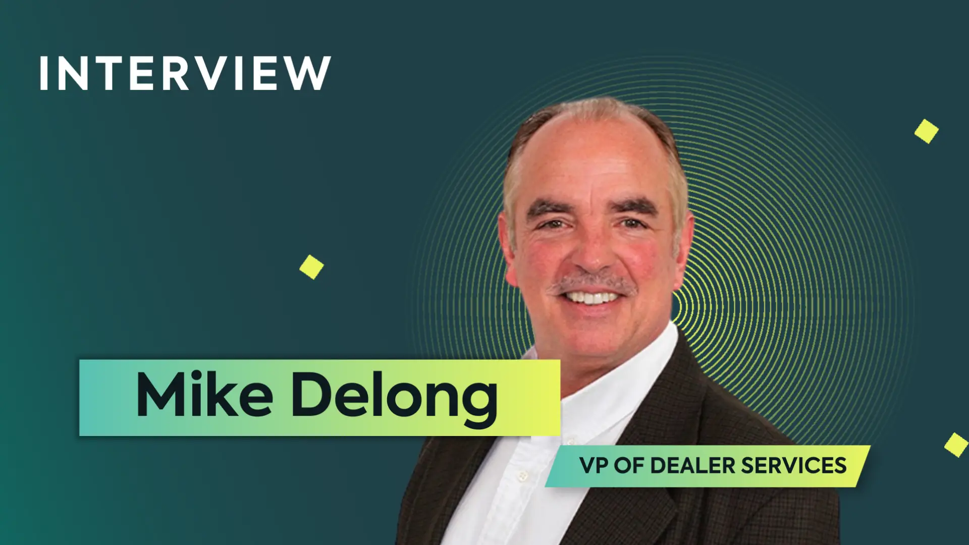 A photo of a man in a suit smiling on a green background. The text says "interview" and "Mike Delong, VP of Dealer Services." There is a yellow spiral and stars behind him.