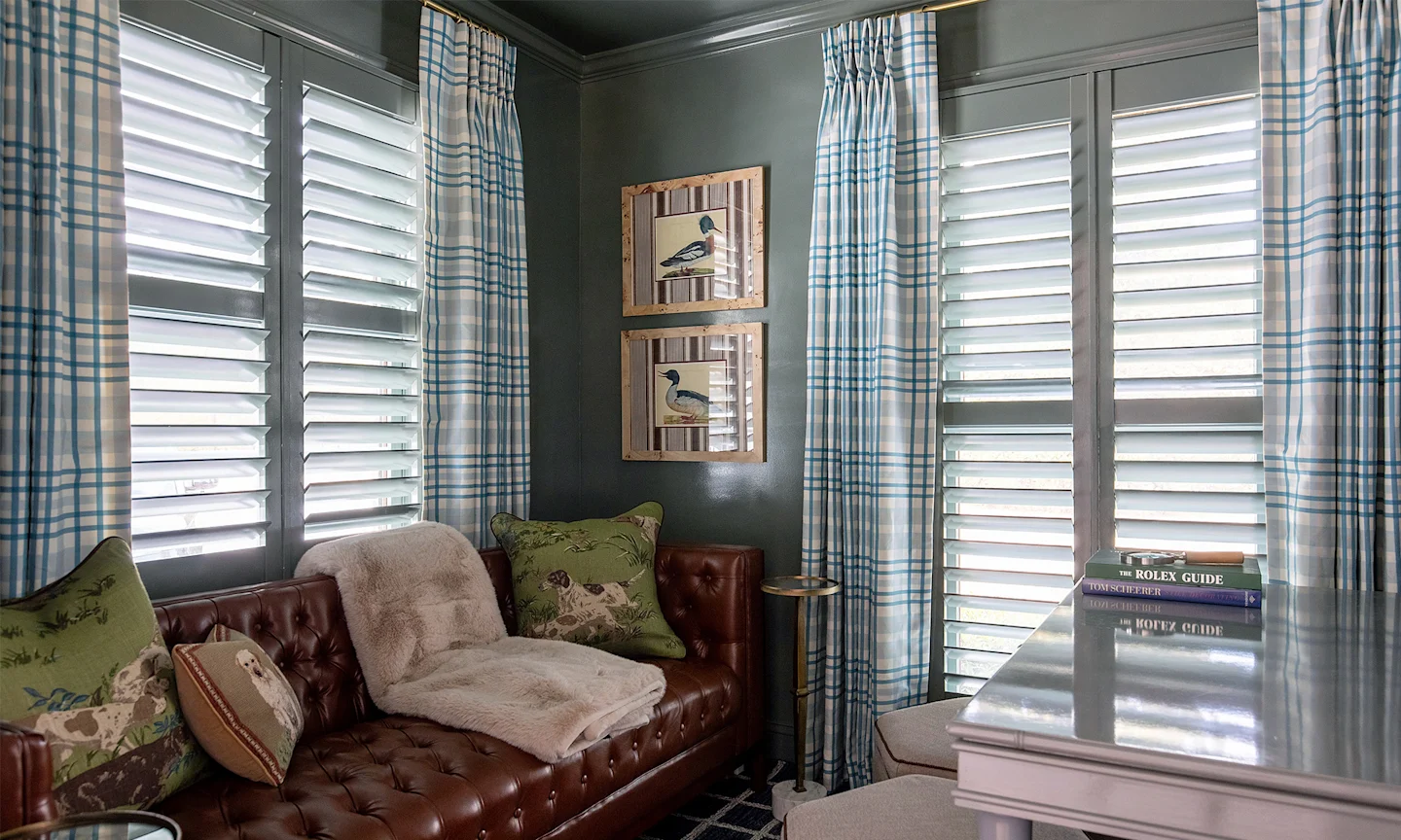 Home office with traditional plaid curtains around the windows.
