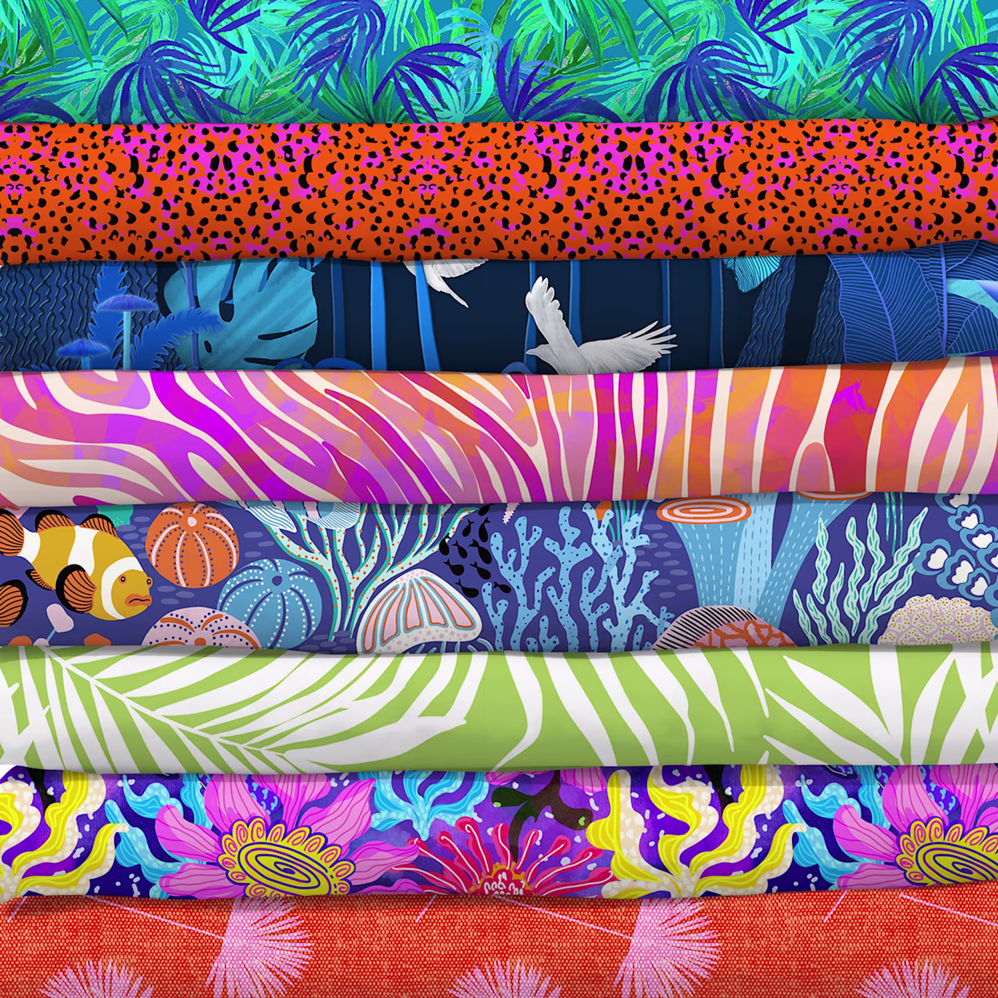 Stack of bright tropical fabrics