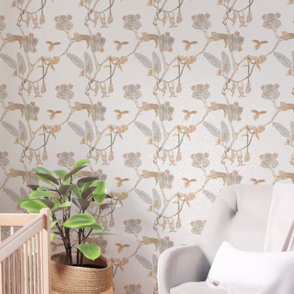 Nursery with Jungle themed wallpaper on the walls.