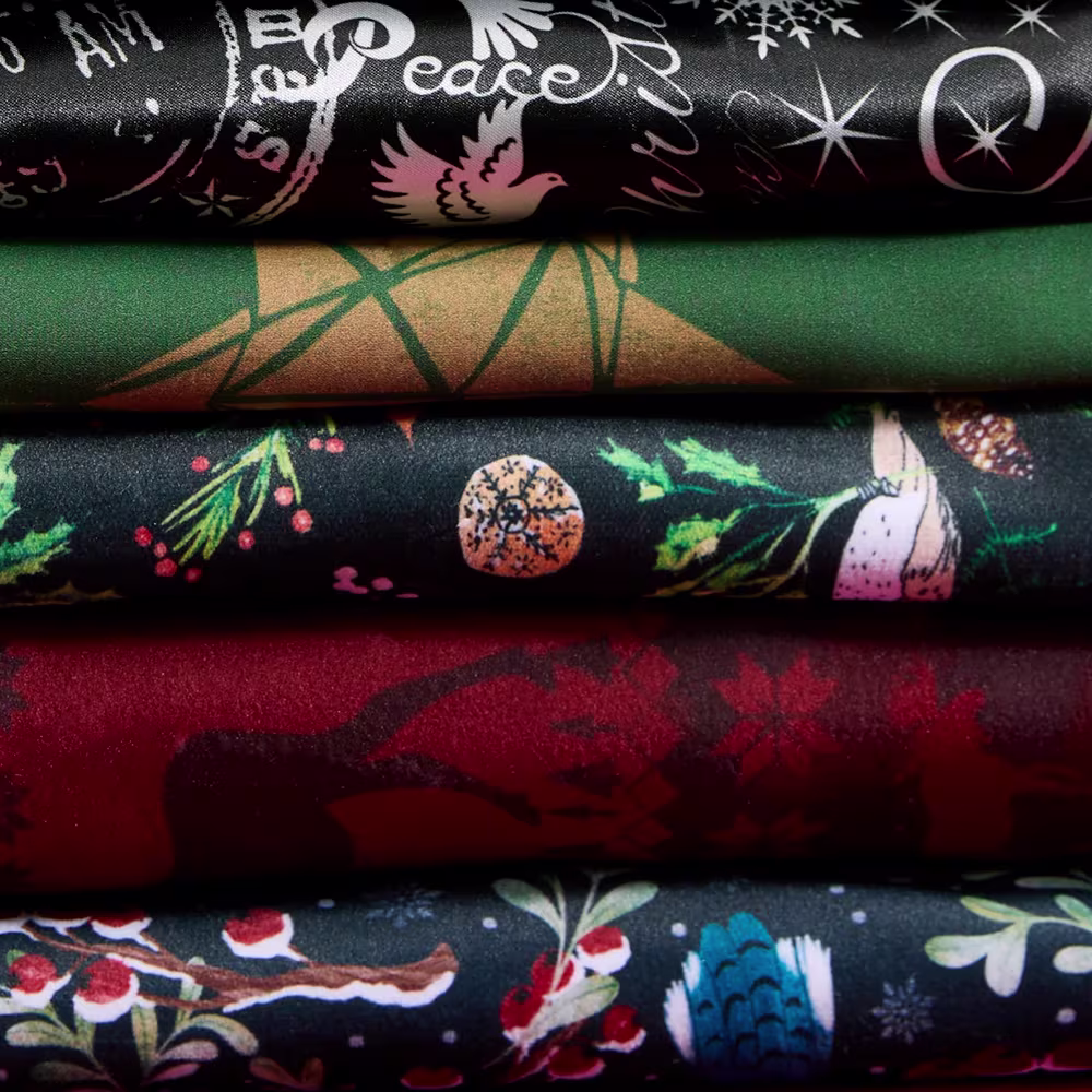Stack of dark christmas fabrics