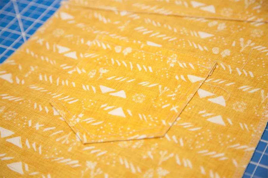 A close up of the back pocket stitched to the skirt.