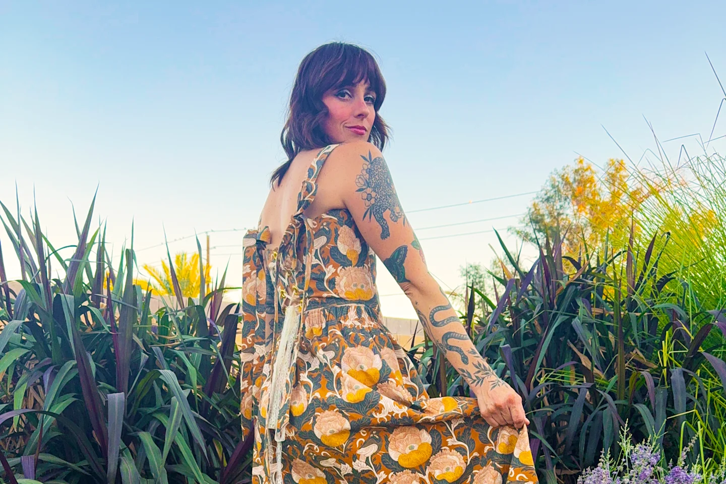 Kelsey Garner in a yellow and green boho dress