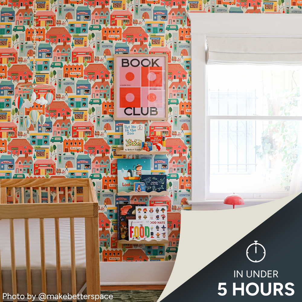 Nursery with book themed wallpaper