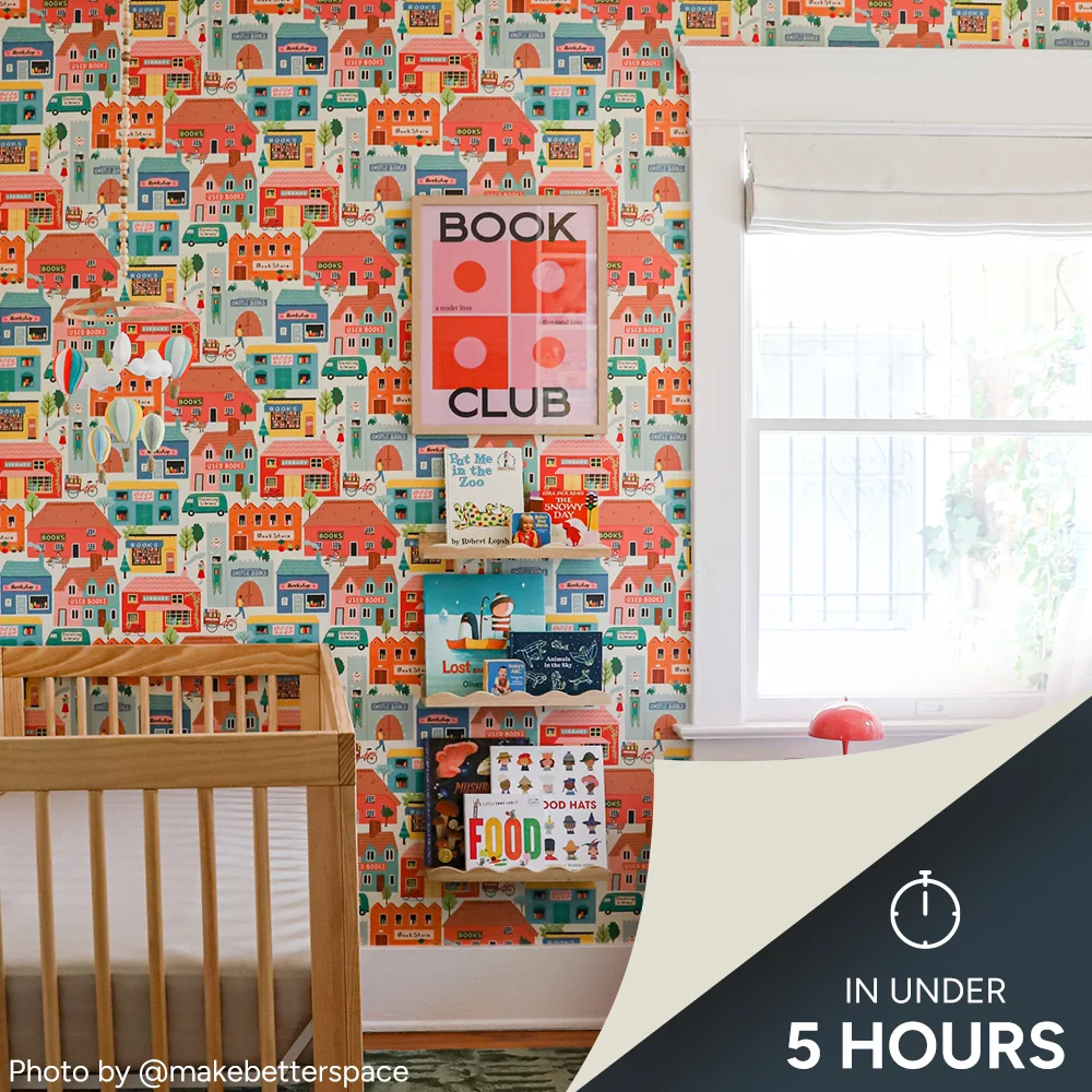 Nursery with book themed wallpaper
