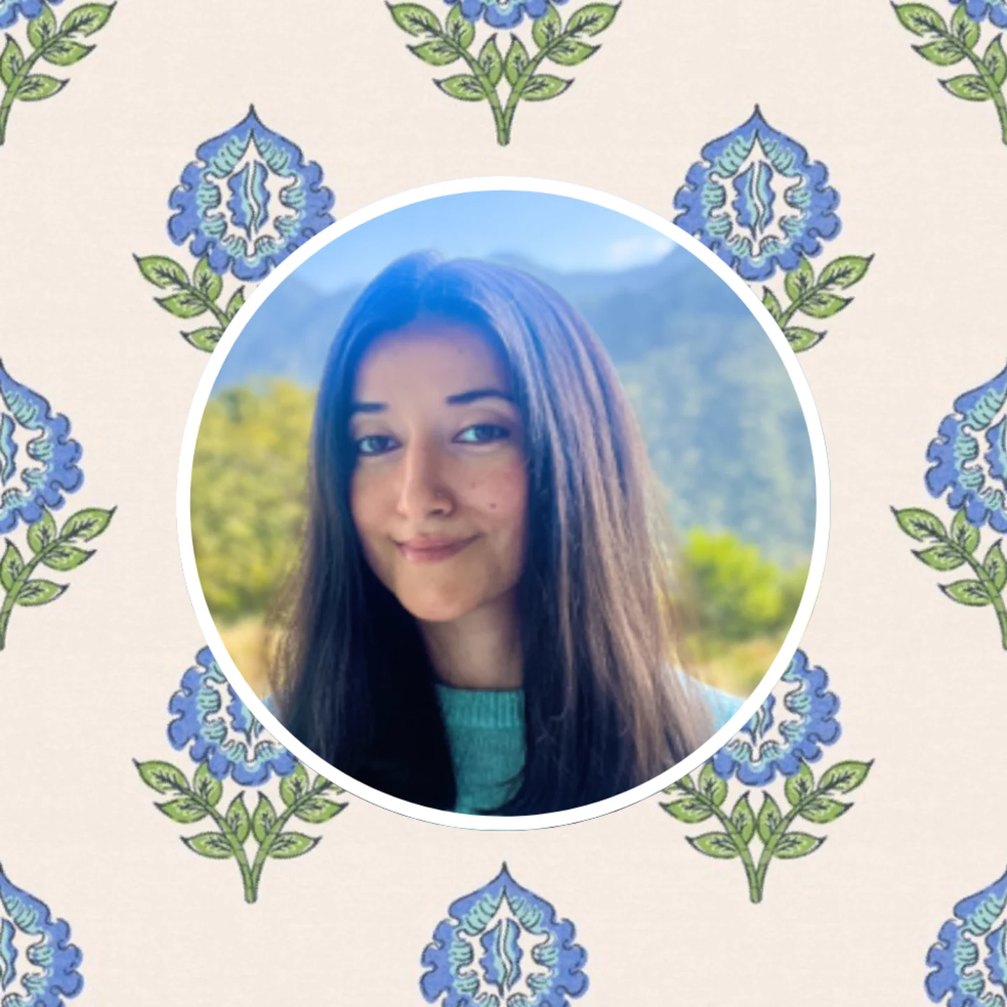 Head shot of Spoonflower artist Gargi Panwar in front of one of her block print designs.