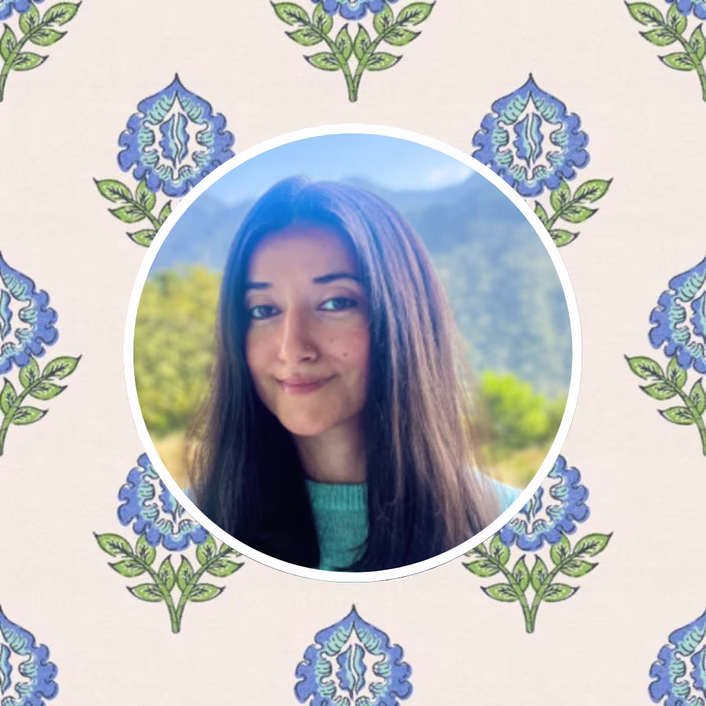Head shot of Spoonflower artist Gargi Panwar in front of one of her block print designs.