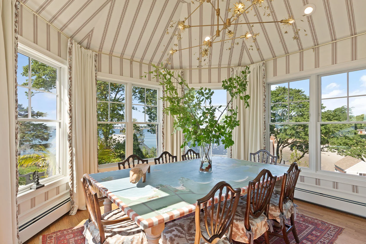 Image showing a dining room featuring striped wallpaper on walls and domed ceiling.