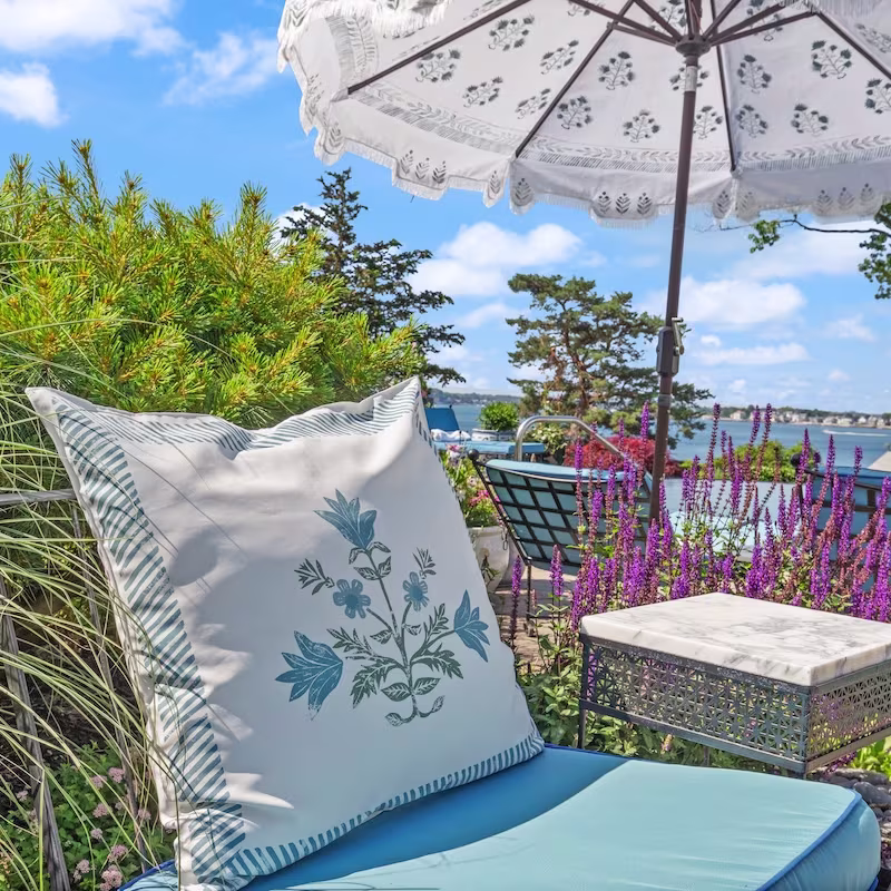 An elegant outdoor throw pillow made with recycled canvas