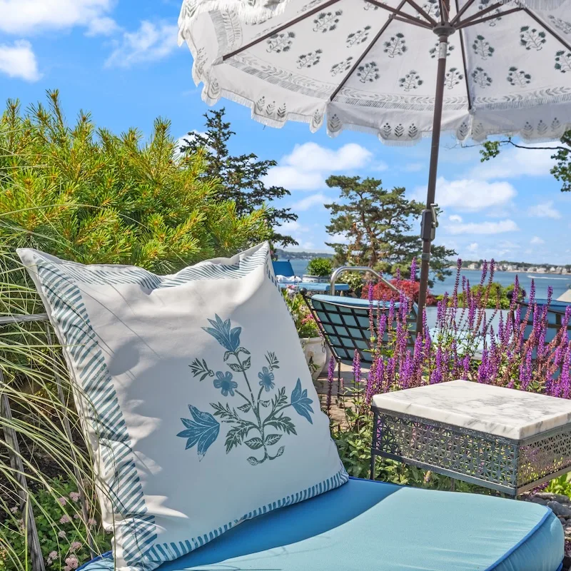 An elegant outdoor throw pillow made with recycled canvas