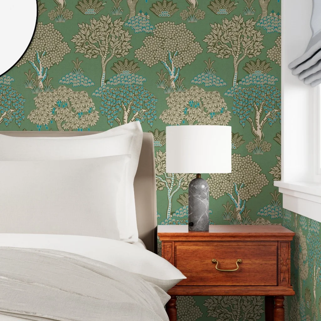 Bedroom with wallpaper in a green jungle trees print by gargipanwar.