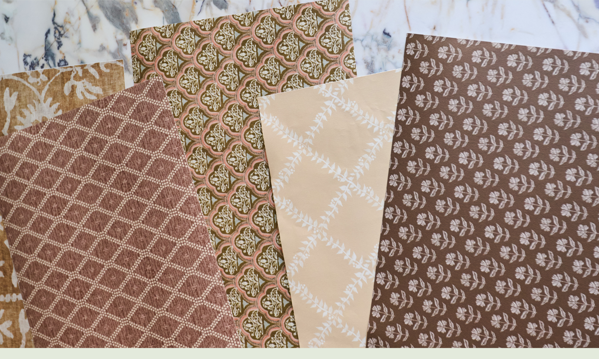 Assorted wallpaper swatches in neutral earth tones