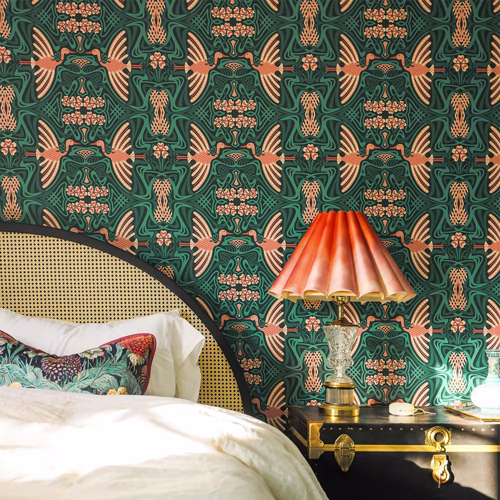 Bedroom with art deco crane wallpaper.