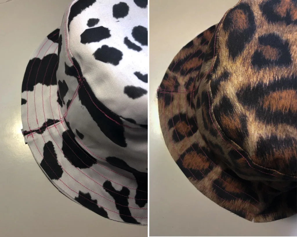 Two sides of the bucket hat, one cow print and one leopard print