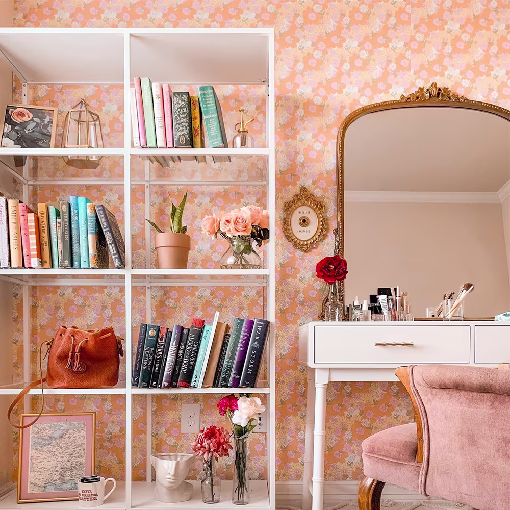Vanity space with peach vintage floral Spoonflower wallpaper on the walls.