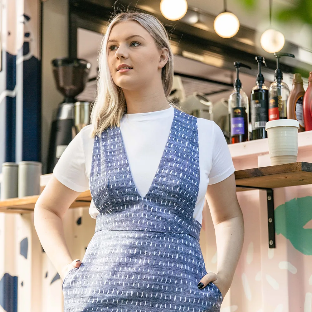 A model wearing a blue jumper dress made with Lightweight Cotton Twill