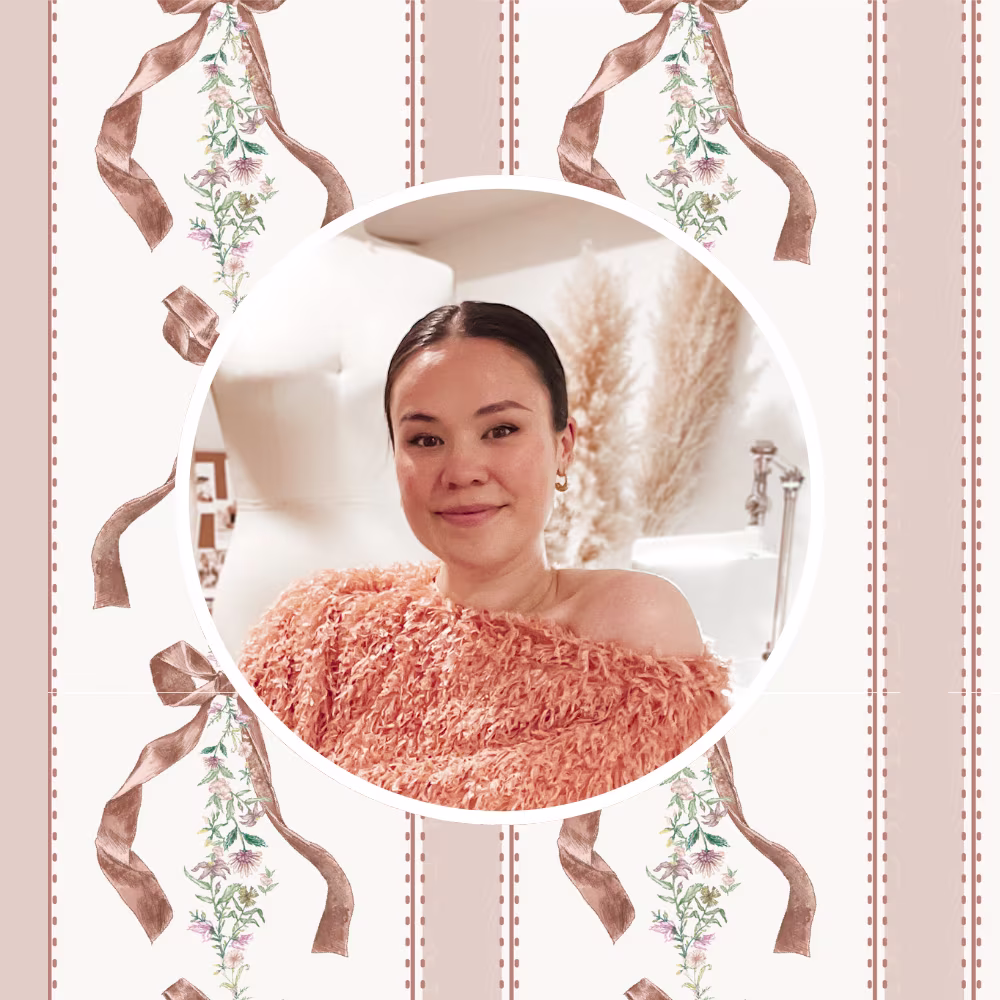 A headshot of Veronica Tucker in front of one of her hand-painted ribbon designs