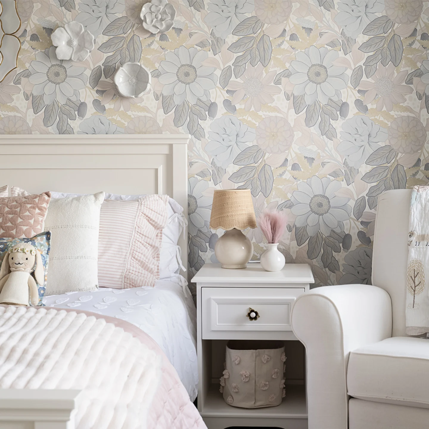 Kids room with large neutral floral peel and stick wallpaper.
