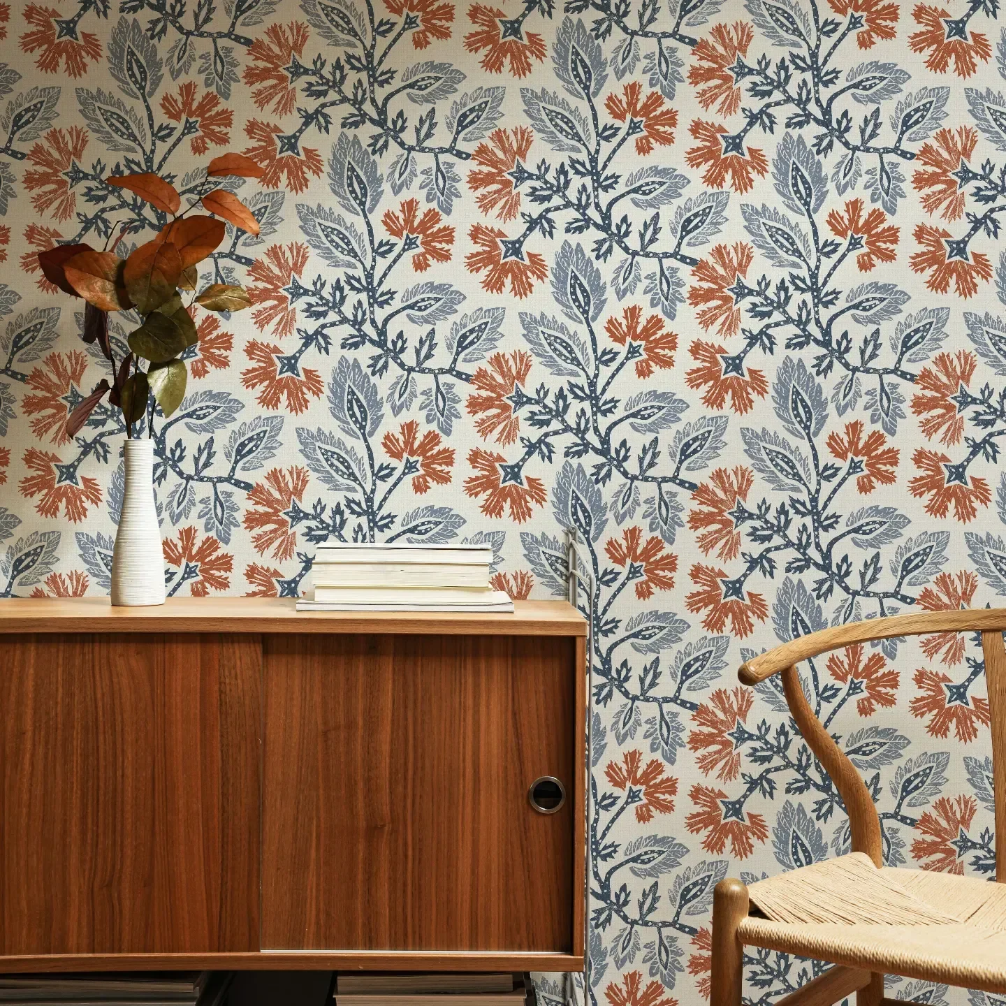 Living area with a blue and orange block printed carnation design by apostrofodesign.