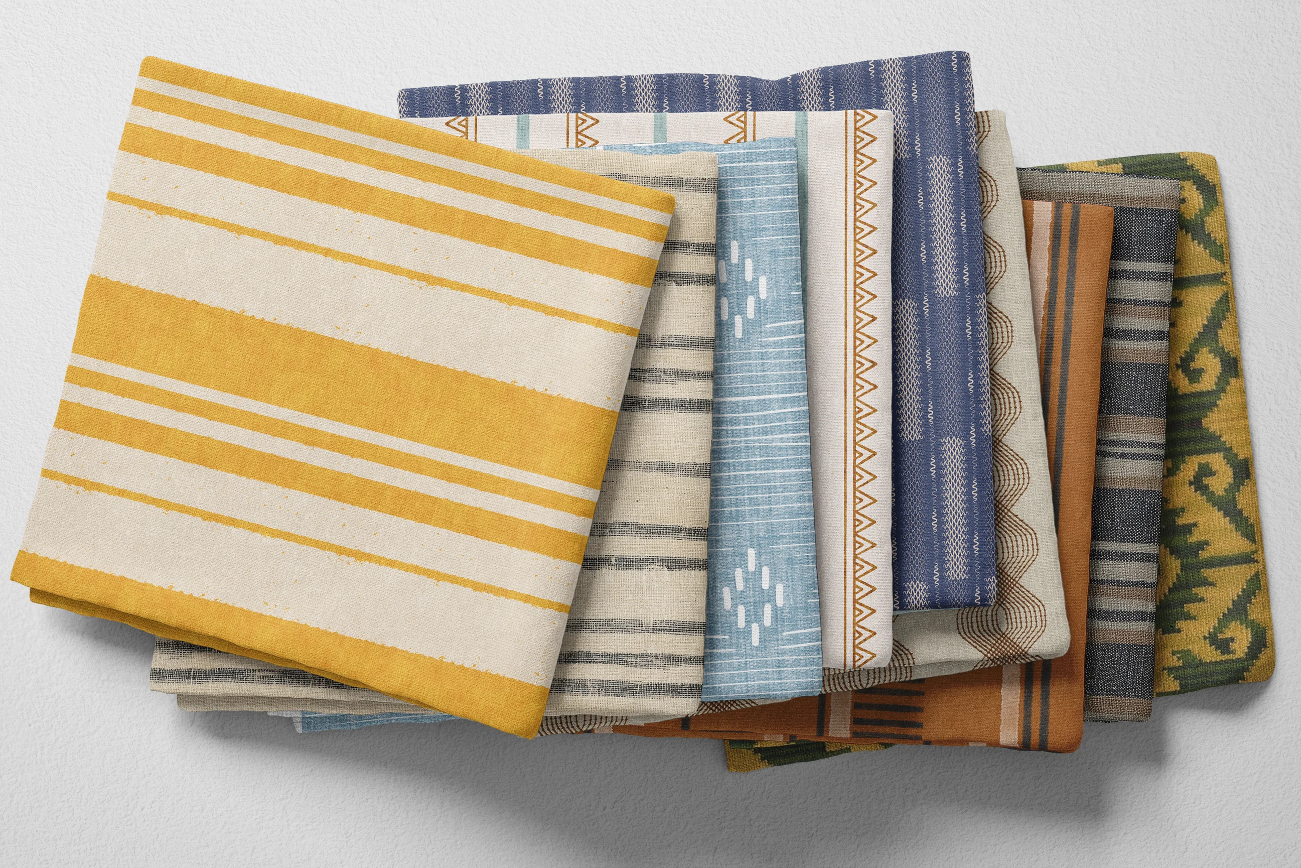 Colorful folded Spoonflower fabric with vintage-inspired distressed prints