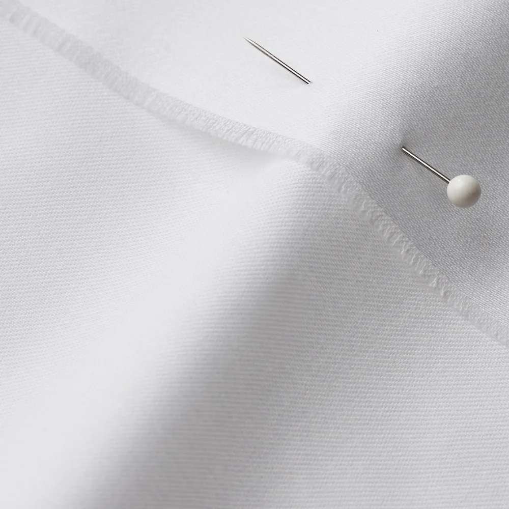 Organic Cotton Sateen fabric with a seam and pin through