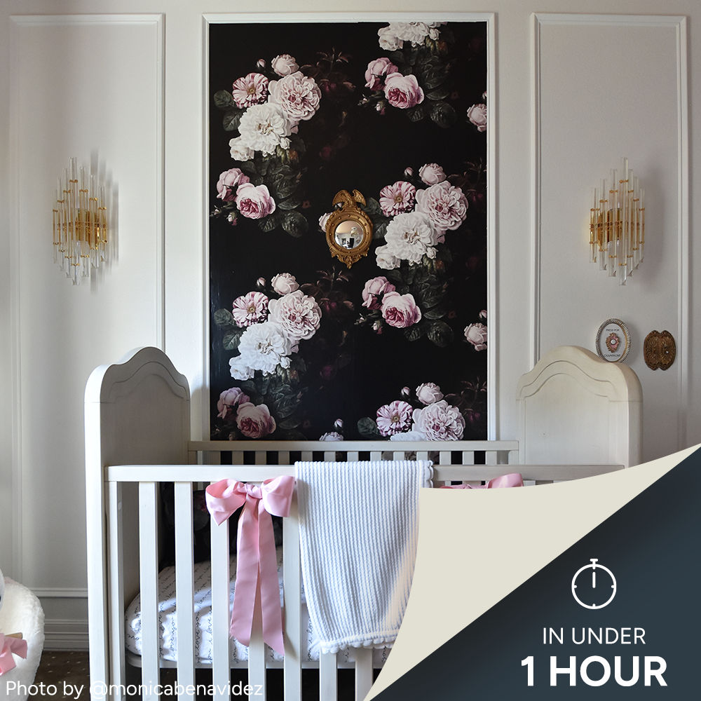 Nursery with bold floral wallpaper panel