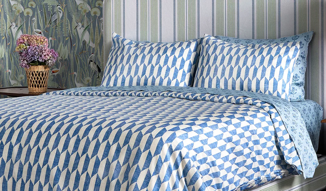 An elegant bedroom with a coastal theme