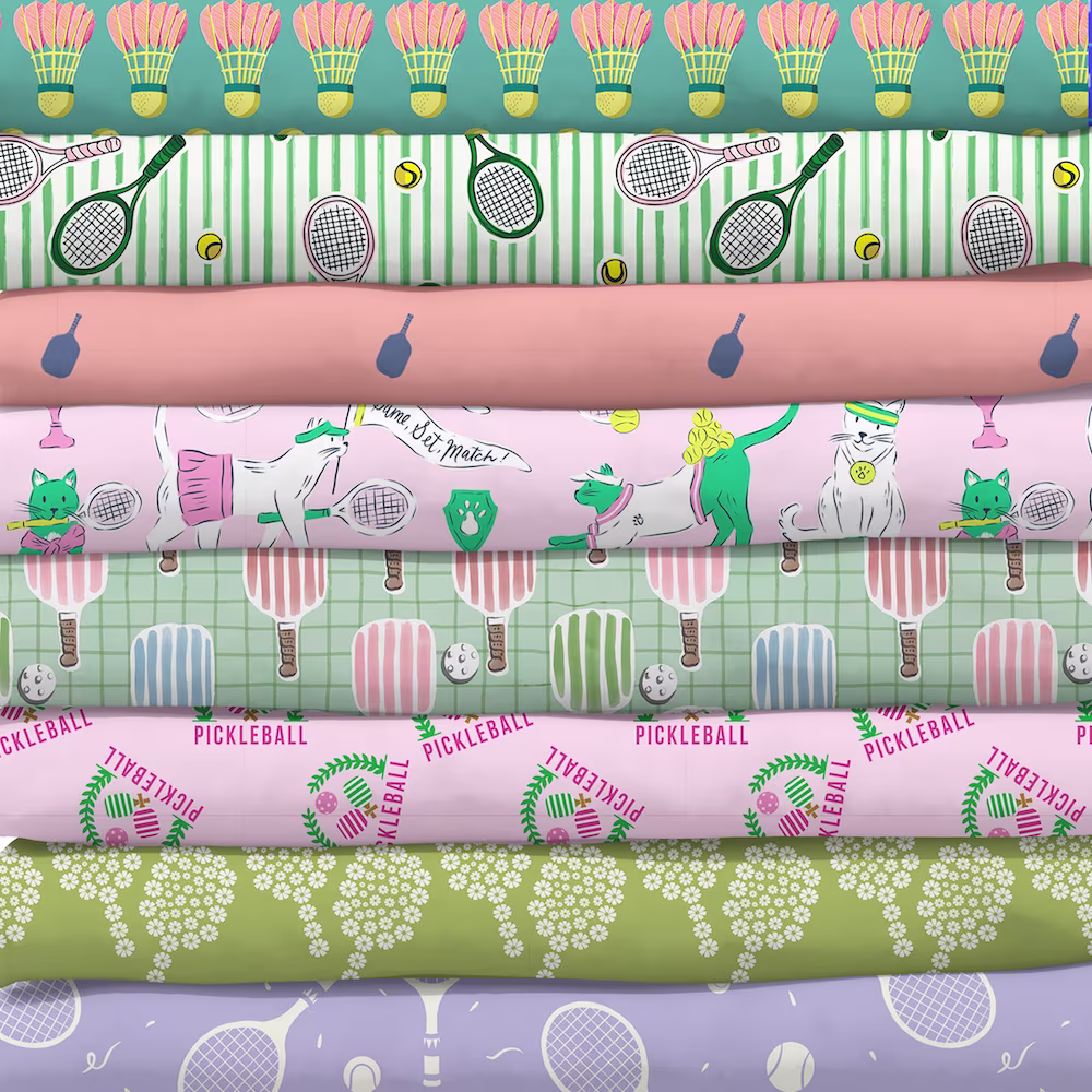 Stack of sports themed fabrics