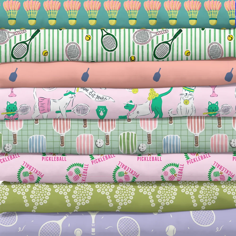 Stack of sports themed fabrics