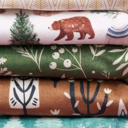 Stack of winter-themed fabrics