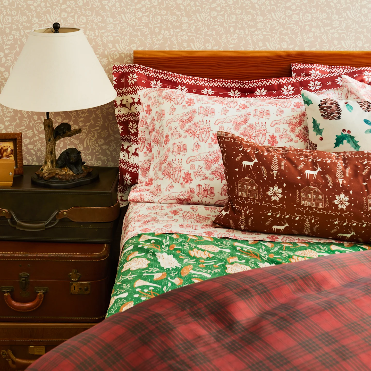 A cozy holiday bed with a winter tartan duvet