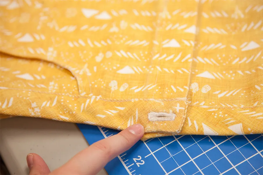 A close up of the button hole sewn before adding the button.