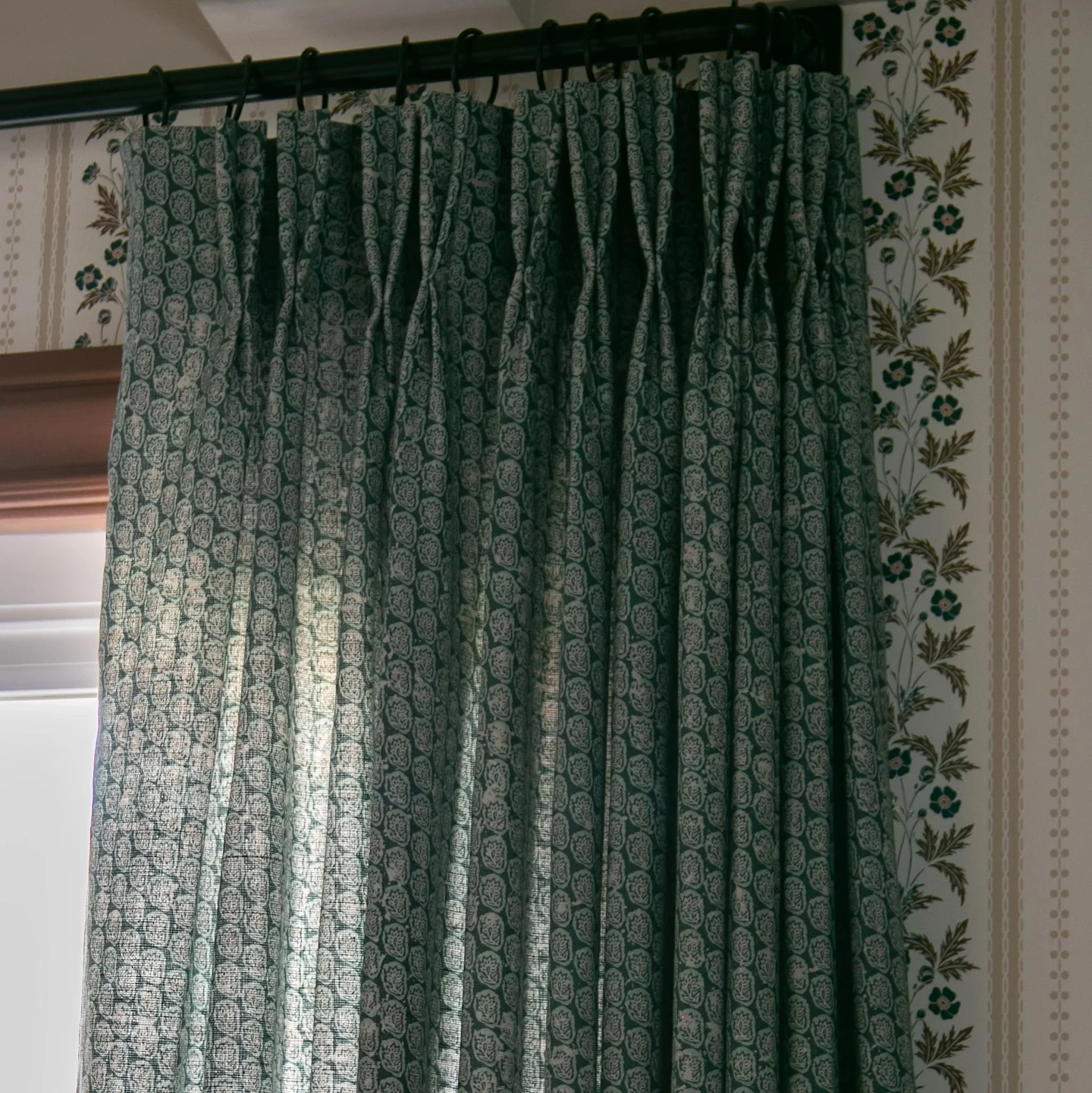A traditional floral belgian linen curtain in slate blue