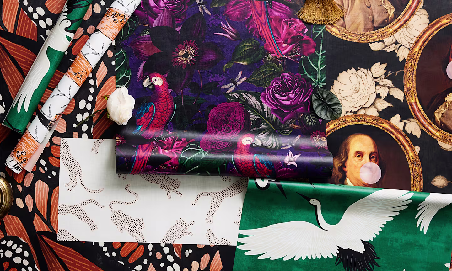 Dramatic glamour peel and stick wallpaper rolls and swathes styled together.