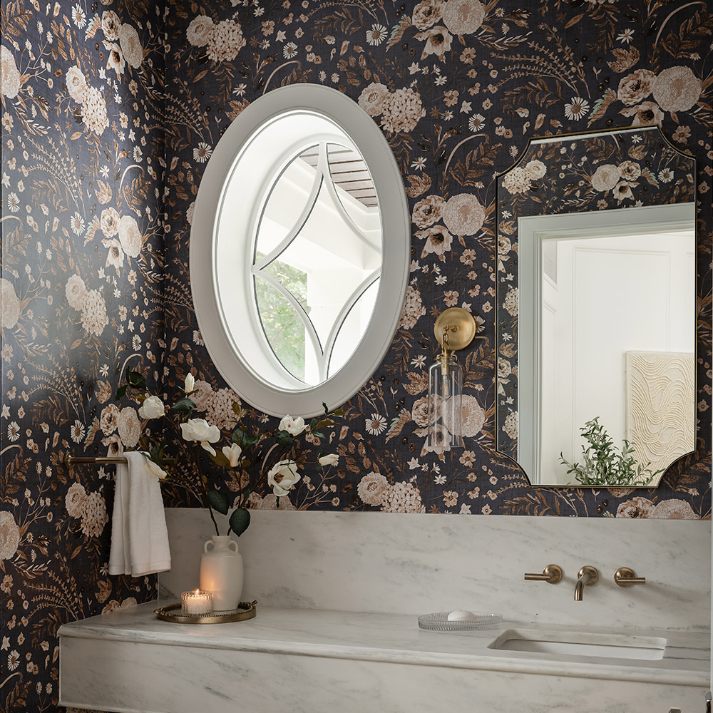 Bathroom or powder room with grey floral wallpaper.